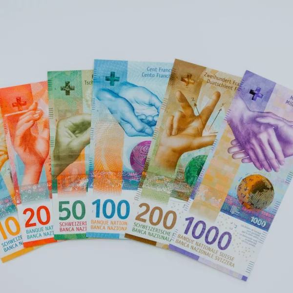 10 and 100 banknotes on white table