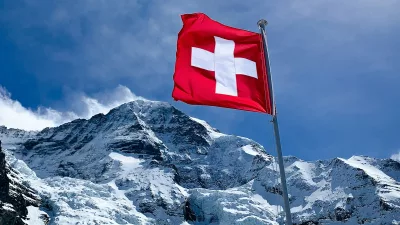 red flag on top of snow covered mountain