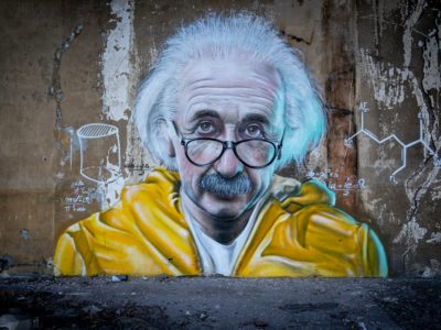 man in yellow and blue hoodie wearing eyeglasses